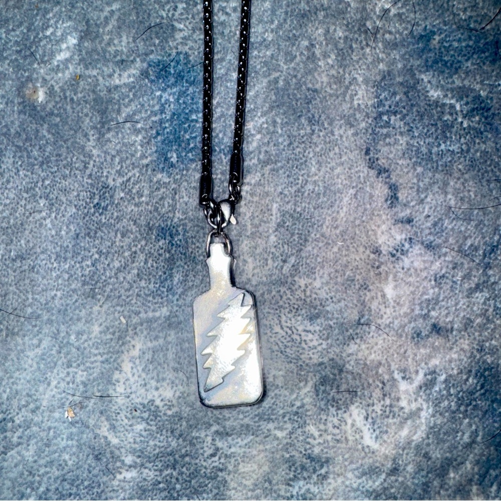 Grateful Dead authentic silver from tour designer. 13 point bolt